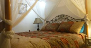 Four post bed with drapery